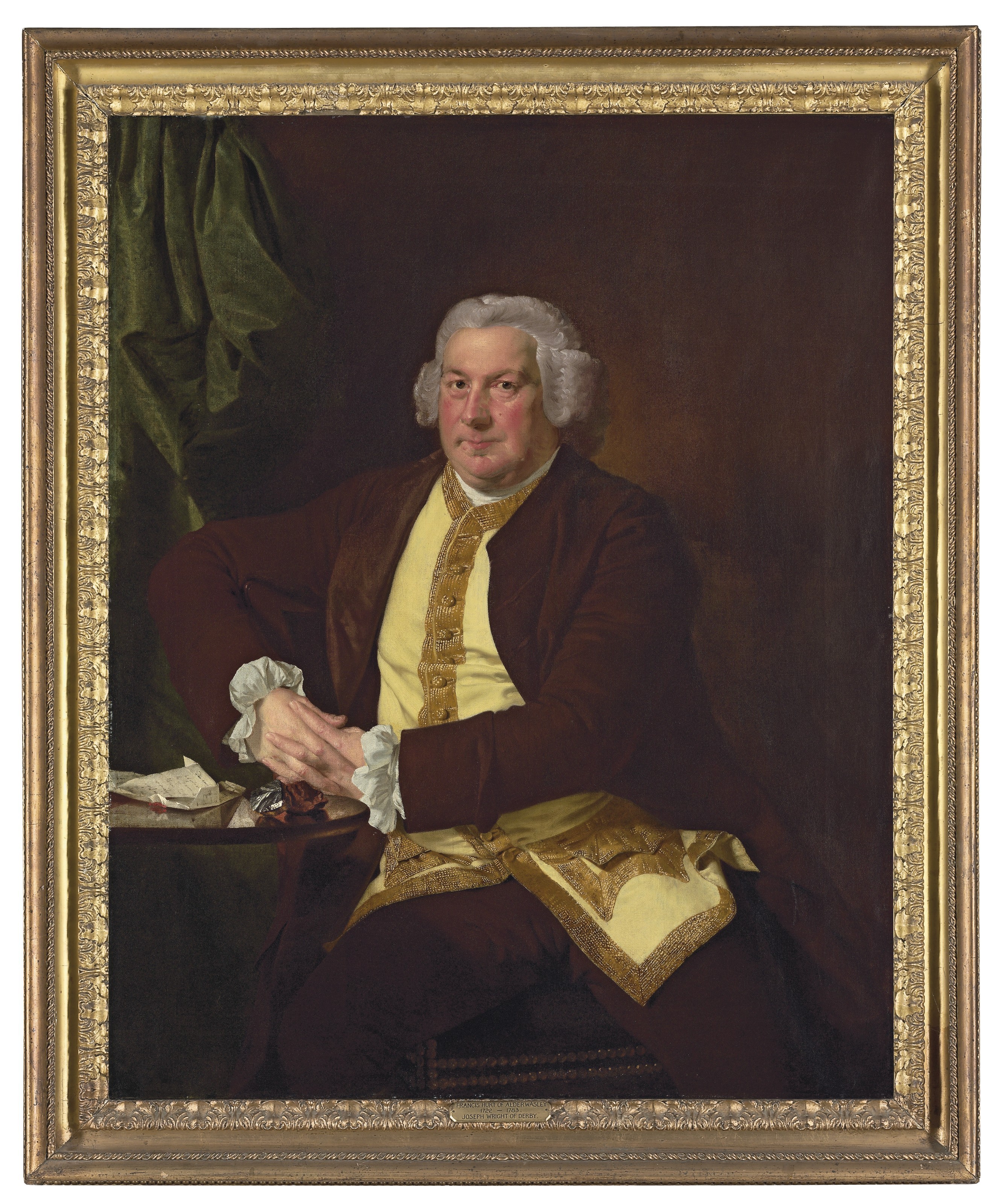 Portrait of a man, called Francis Hurt; half-length, turned slightly to the left, eyes facing forward. He is seated beside a highly polished dark wood table upon which is a document and two geological samples; one red, the other grey. To the left is a deep green silk drape. He wears a light grey wig, rolled at the temples, and a dark brown coat and matching knee-breeches. His coat is open to reveal a pale yellow waistcoat edged at the centre-front and bottom, as well as the pockets, with metallic gold 'lace'. Painted by Joseph Wright of Derby (1734 - 1797). Oil on canvas in gilded frame.