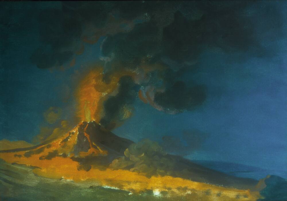 Painting of a volcano in eruption, titled 'Vesuvius in Eruption'. The volcano occupies the left two thirds of the paper. To the right the land drops away to reveal a view of the sea. A plume of lava and dark smoke erupts from the volcano's cone. A river of orange-yellow lava flows down the sides of the volcano and overland towards the foreground. The deep blue colour of the sky suggests that this is a nocturnal event. Painted by Joseph Wright (1734-1797). Gouache on paper, mounted for display.