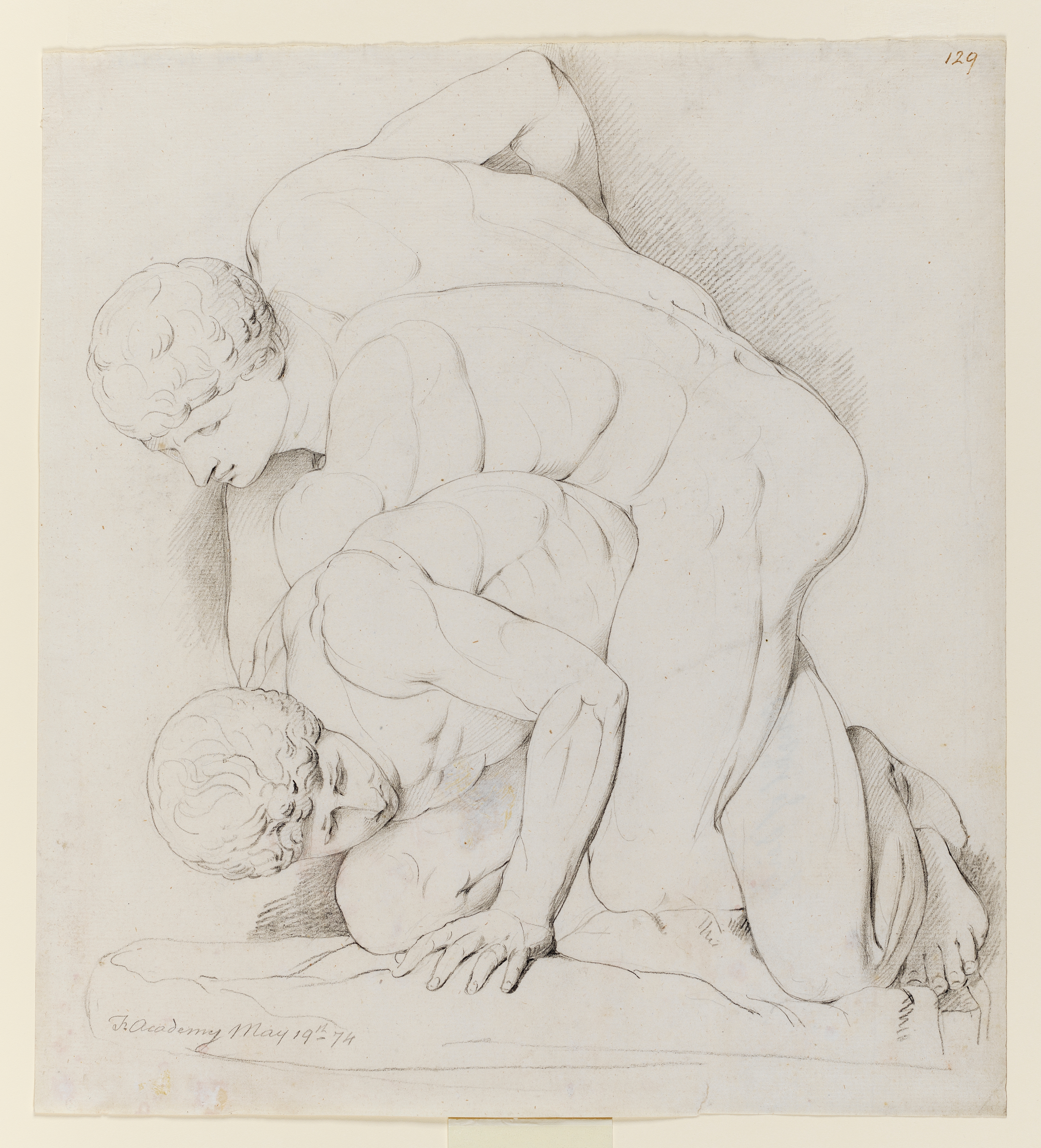 Drawing of two nude men wrestling, identified as 'The Wrestlers', after the Antique sculpture. Inscribed on recto, to lower left, along pedestal of sculpture (handwritten in pencil): 'Fr Academy May 19th - 74' and top right (handwritten in ink): '129'. Made by Joseph Wright of Derby (1734-1792), 1774. Pencil on paper. Displayed in a cream window mount.