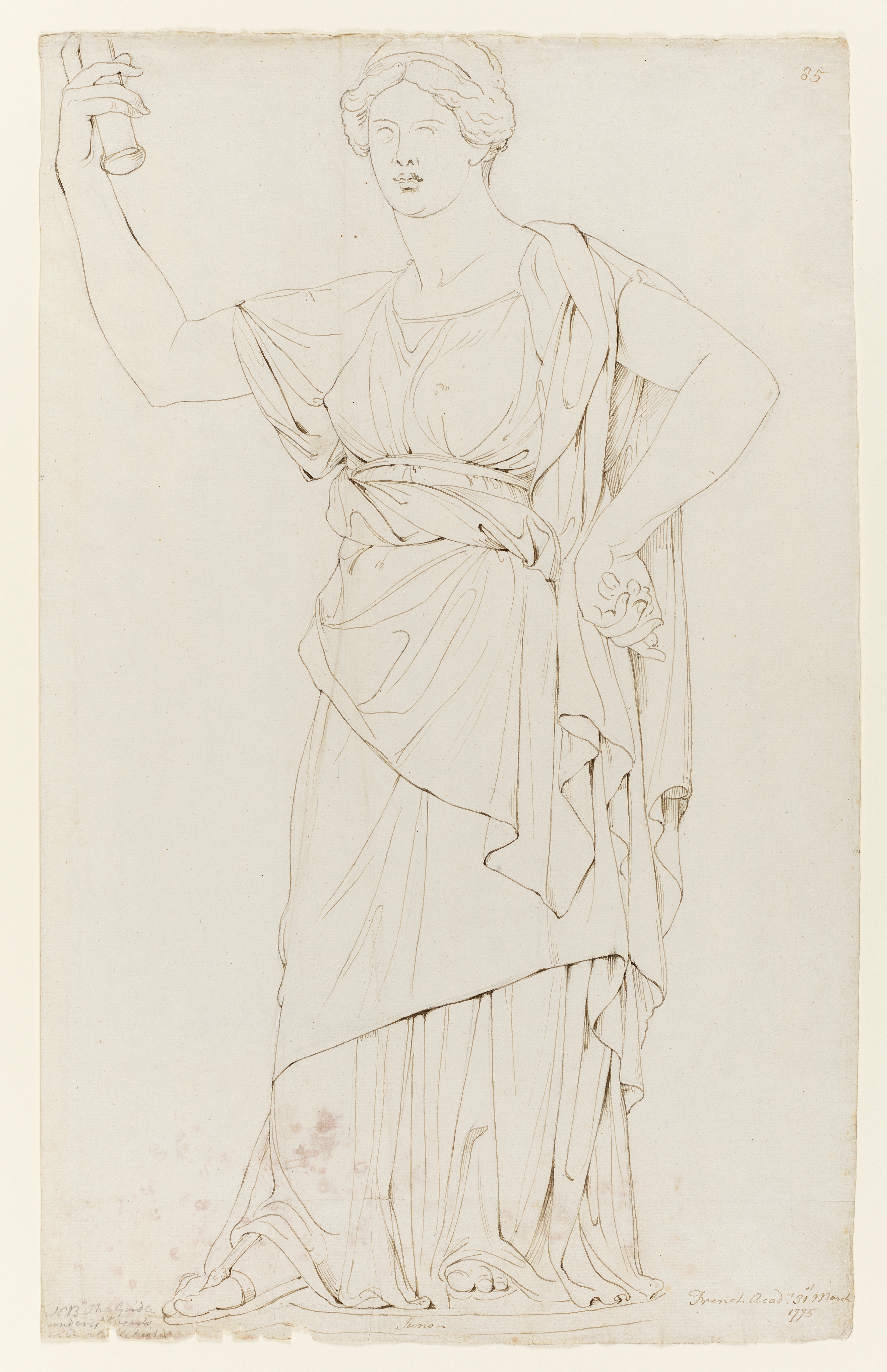 Drawing of a standing female figure, identified as a study of a cast of an Hellenistic sculpture known as 'Juno'. Inscribed upper right (handwritten in ink): '85', and to lower left (handwritten in pencil: 'NB The Girdle / under ye Breasts / to be a little higher', and to lower right: 'French Acady. 31st March / 1775'. Also inscribed along pedestal (handwritten in ink): 'Juno'. Made by Joseph Wright of Derby (1734 - 1797), 1775. Pen and ink over pencil on laid paper. Displayed in a cream window mount.
