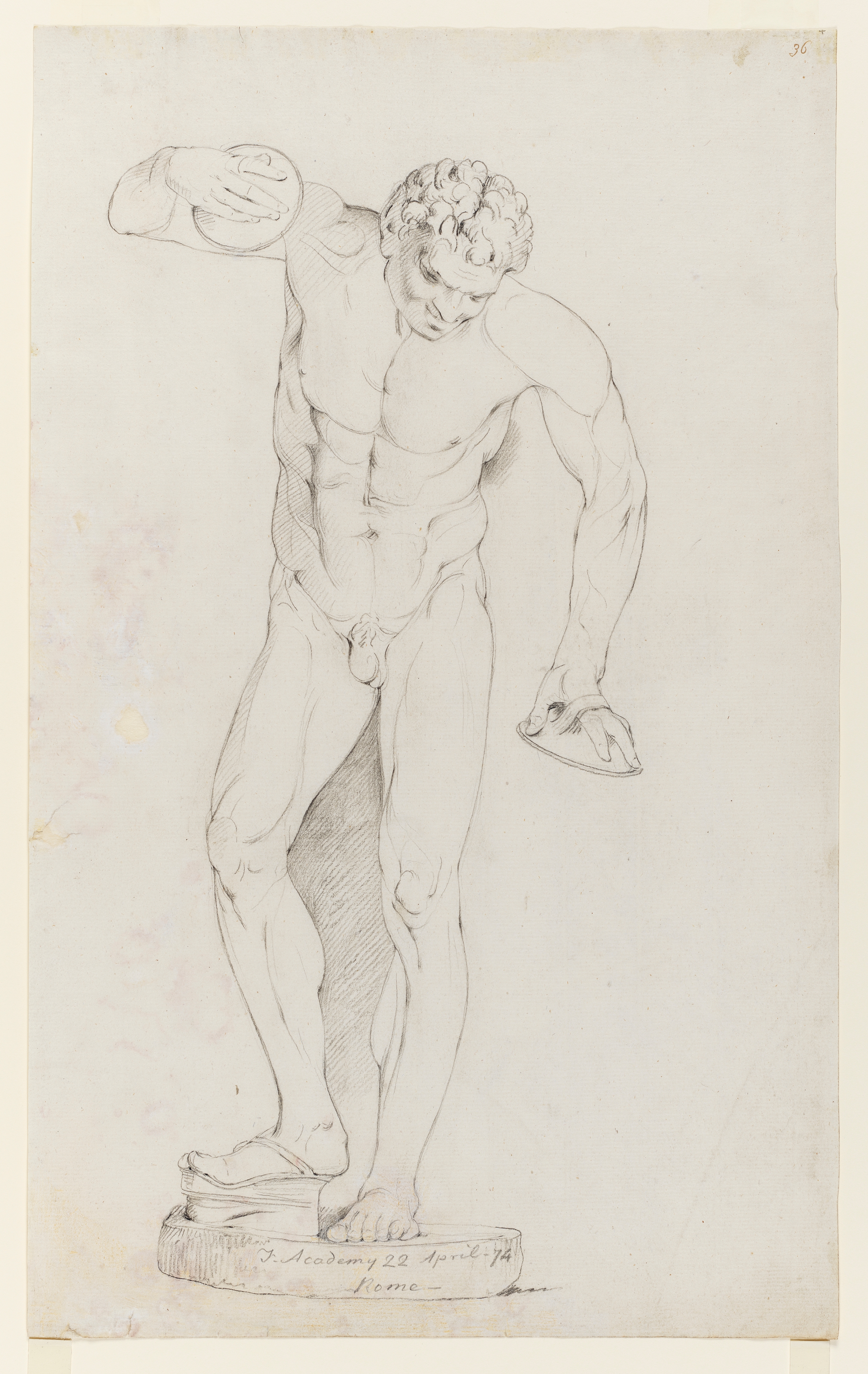 A drawing of a nude, male figure dancing, identified as the 'Dancing Faun (or Satyr)', after a cast from the Antique sculpture at the Uffizi Gallery, Florence. The figure is standing, with his right foot on a ‘scabellum’ (a foot-clapper). He holds cymbals in each of his hands. Inscribed on recto, along the pedestal of the sculpture (handwritten in pencil): 'F. Academy 22 April - 74 / Rome' and in the top right corner (handwritten in ink): '36'. Lower right corner creased. Made by Joseph Wright of Derby (1734 - 1797), 1774. Pencil on paper. Displayed in a cream window mount.