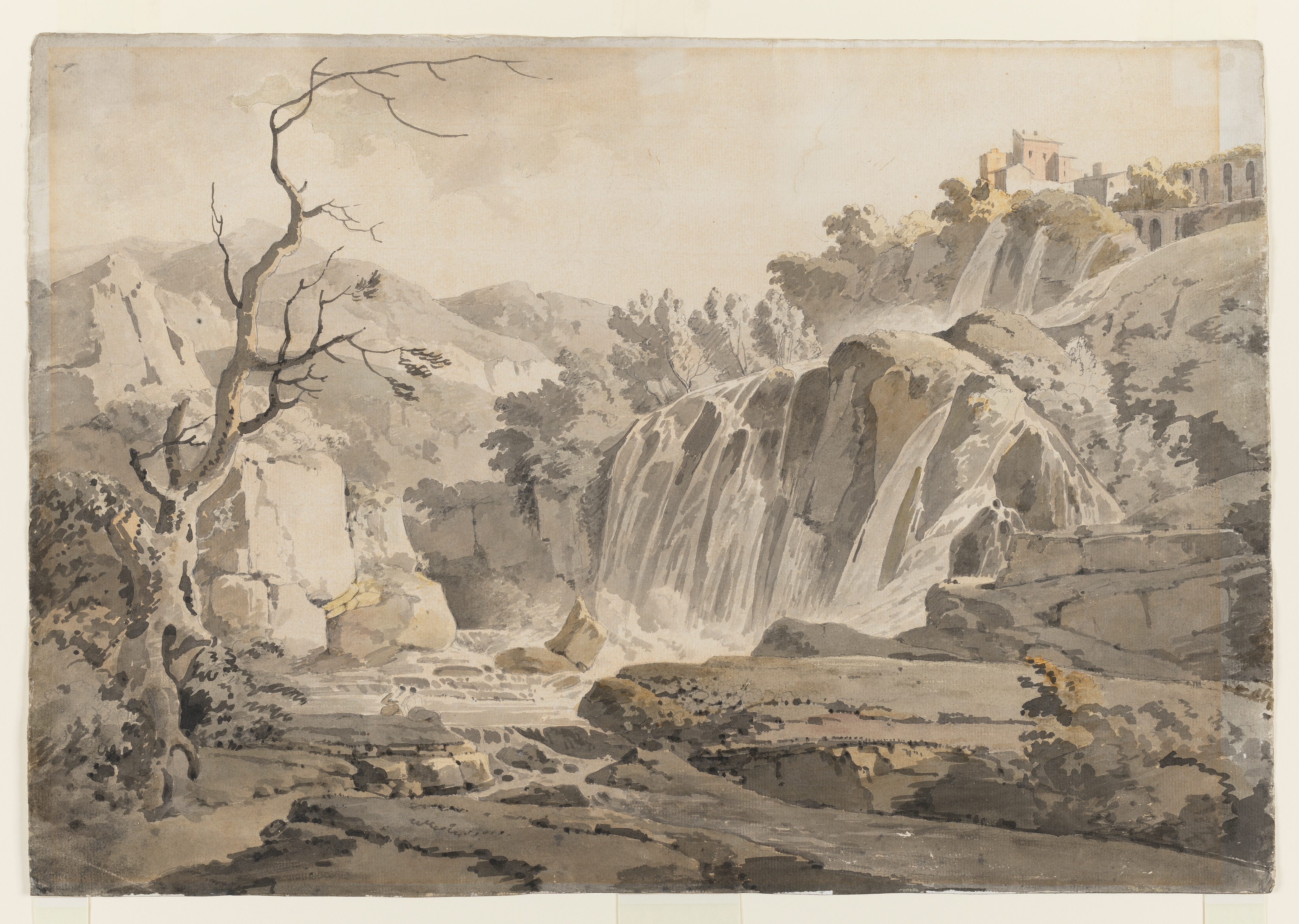 Drawing of a landscape with a waterfall, identified as the 'falls of Tivoli', Rome. To the left is a bare tree. To the right, perched high above the waterfall, are buildings.
Inscribed on verso, to top right corner (handwritten in ink): 'T G 1798'; verso, upper right (handwritten in pencil): 'By Mr Wright'; verso, lower centre (handwritten in pencil): 'The Hon'ble Mrs W E Griffiths'. Made by Joseph Wright of Derby (1734 - 1797), c.1786. Ink and watercolour washes over pencil on laid paper. Displayed in a cream window mount.