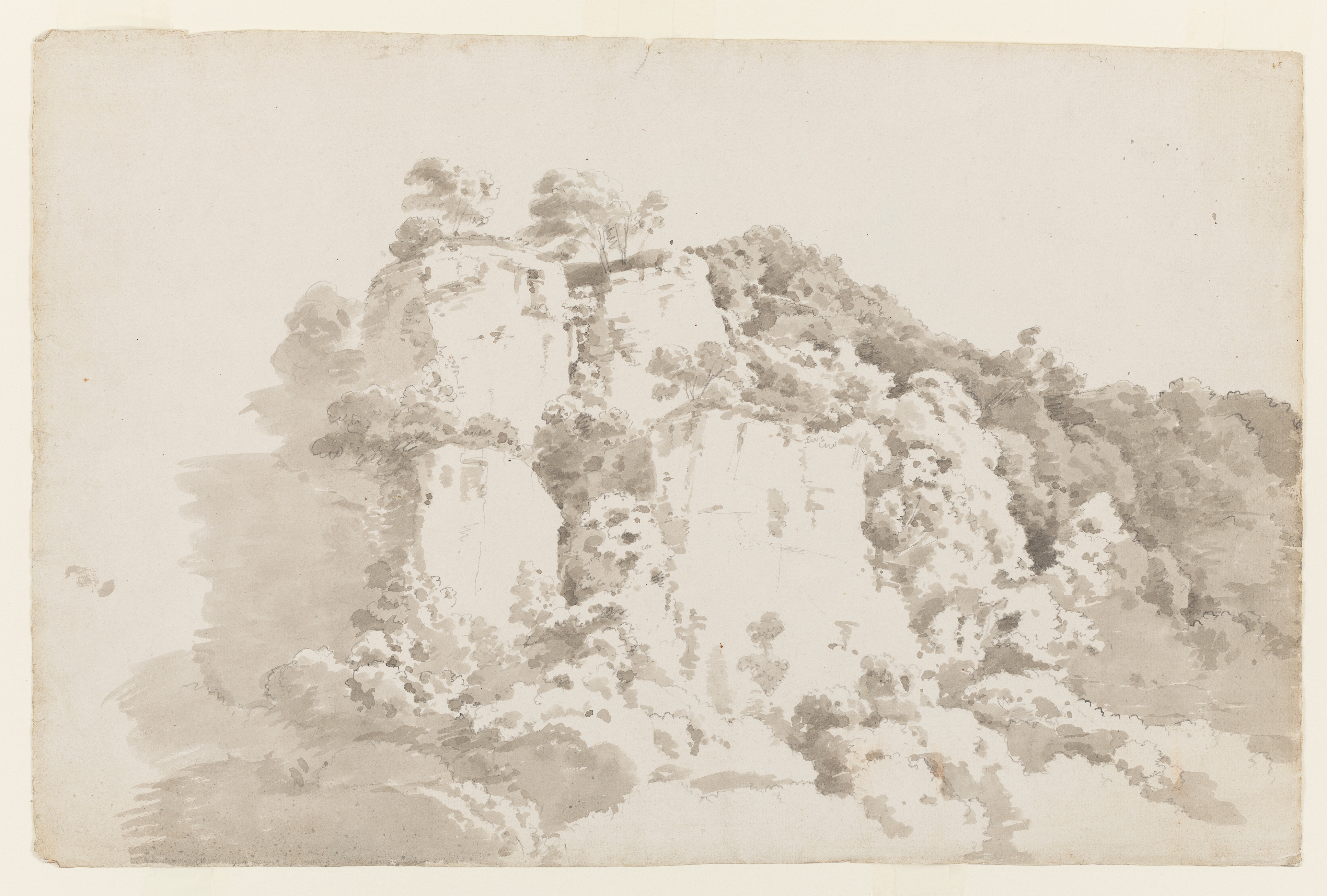 Drawing of a landscape featuring what appears to be a limstone tor. Inscribed on the verso (handwritten in ink): 'T G 1798'. Made by Joseph Wright of Derby (1734 - 1797), c.1783-1787. Ink washes over pencil on laid paper. Displayed in a cream window mount.
