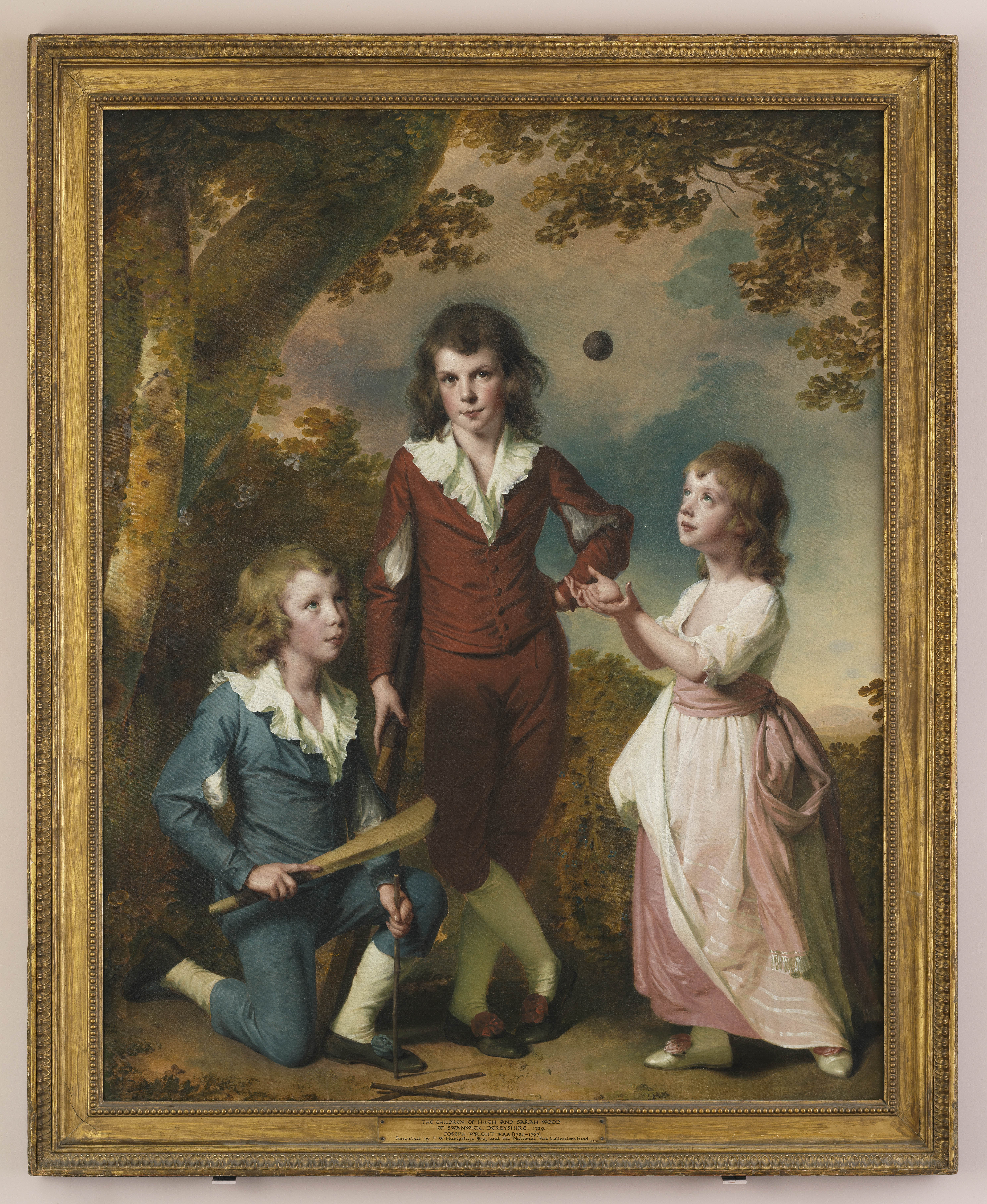 Portrait of three children playing cricket within a glade, called 'The Wood Children'. They are Robert (left), John (centre) and Mary (right), children of Hugh and Sarah Wood of Swanwick Derbyshire. An inscription to the lower left of the canvas reads: 'I. W. P. / 1789'. Painted by Joseph Wright of Derby (1734 - 1797). Oil on canvas in gilded frame.