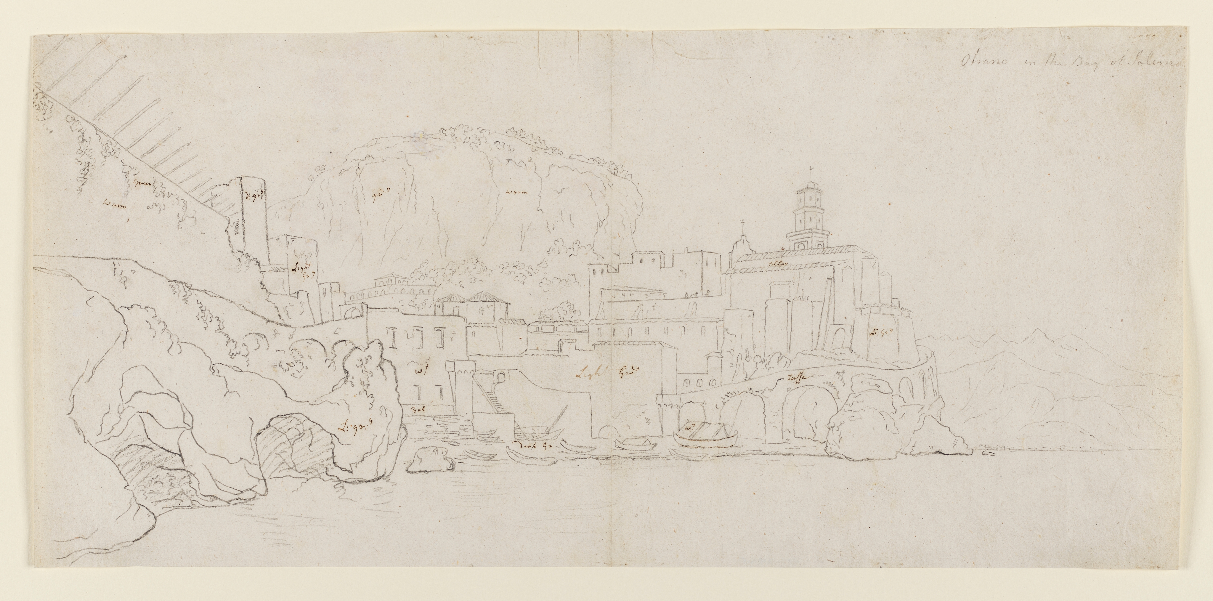 Drawing of a landscape, identified as Otrano in the Bay of Salerno, Italy. The bay is scattered with buildings and boats are moored around the harbour and grottoes. Inscribed upper right (handwritten in pencil): 'Otrano in the Bay of Salerno' and throughout the drawing (handwritten in ink): 'Dark Gry Yel Light Gry' and 'Warm', as well as 'tiles' and 'tuffa'. Made by Joseph Wright of Derby (1734-1797), c. 1774 - 1775. Pencil and pen an ink on paper. Displayed in a cream window mount.