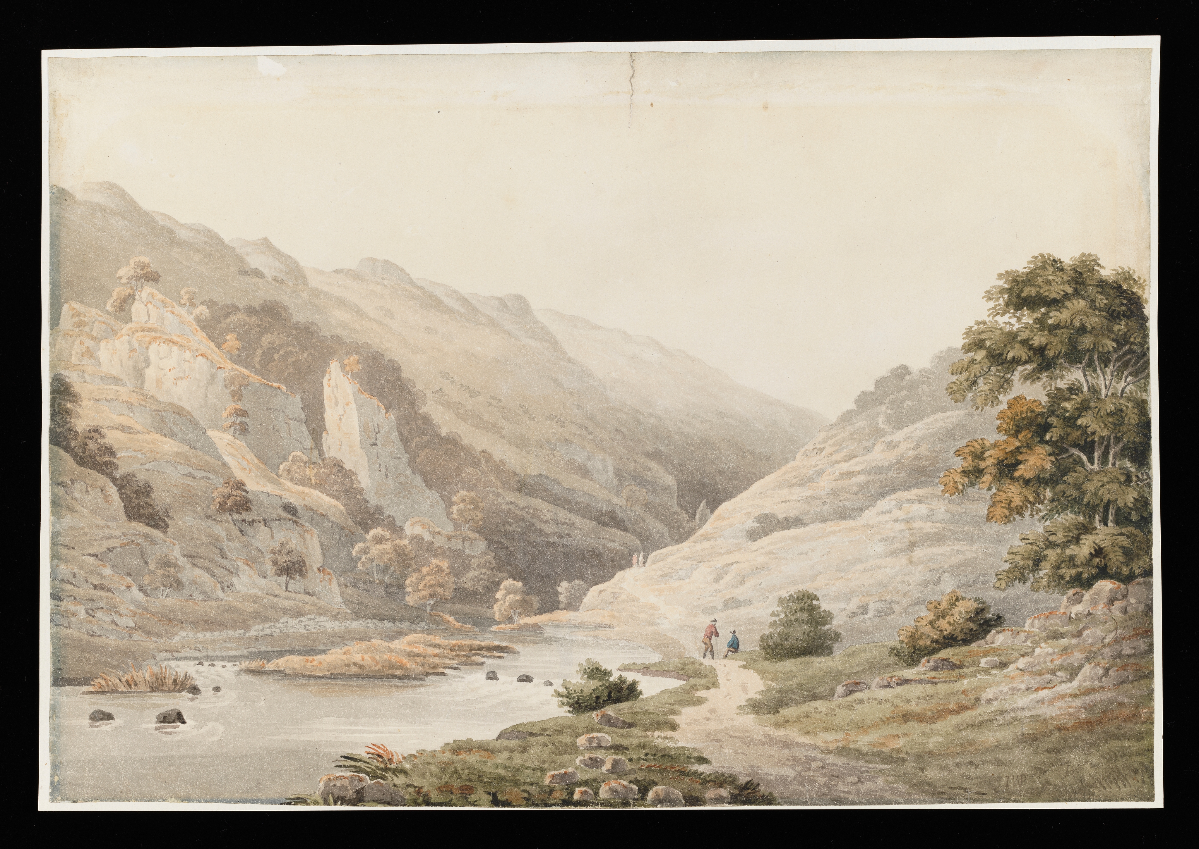 Painting of a landscape, identified as Dovedale, in Derbyshire. To the left of the scene, a collection of sharp rock formations, with a more gentle rise to the right. The River Dove meanders through the centre, whilst to the right of it is a path, upon which two figures are visible. Inscribed to recto, lower right 'IWP'. Painted by Joseph Wright (1734 - 1797). Watercolour on paper, presented in a cream window mount.