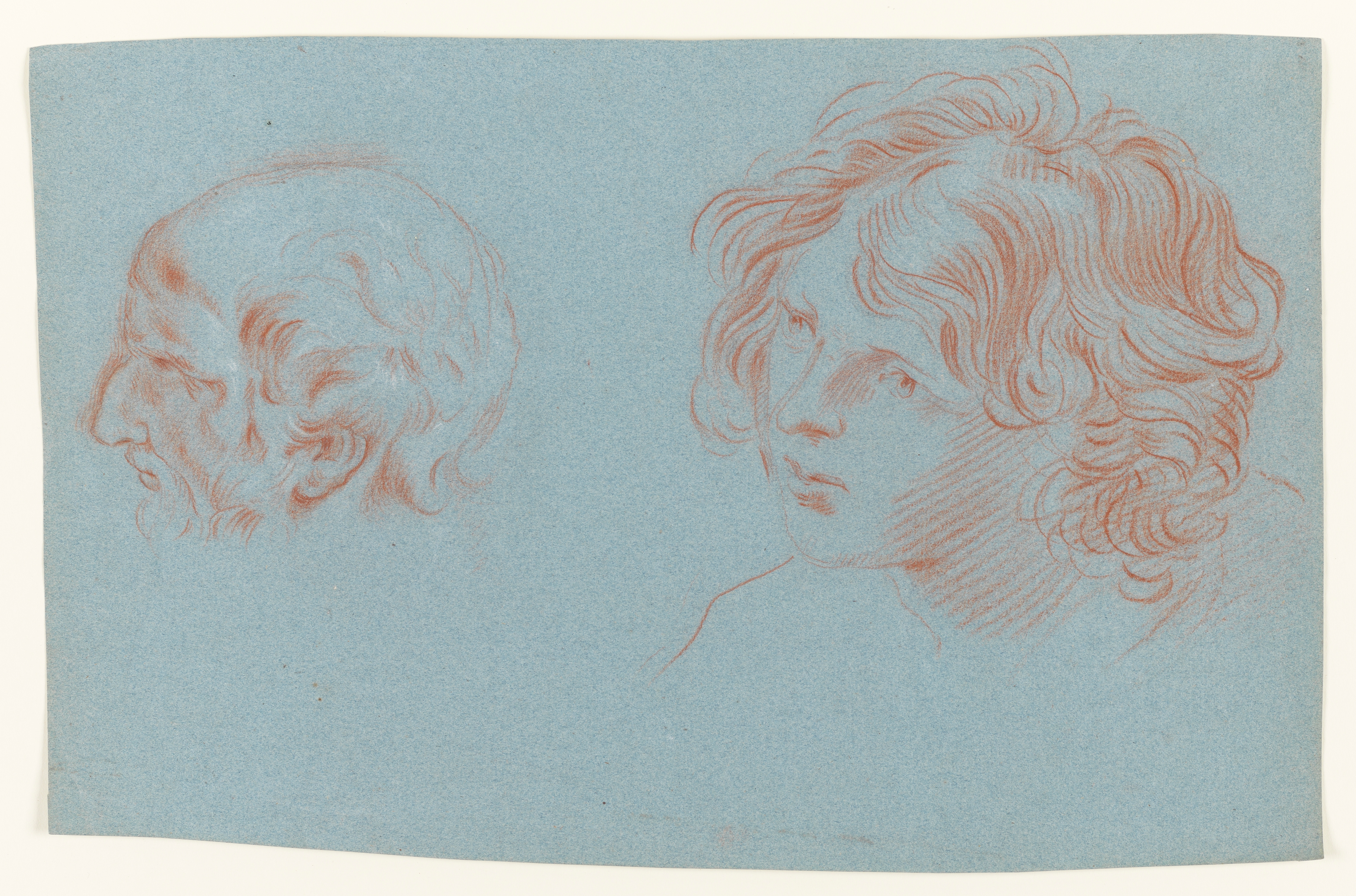 Study of the head of a young man, in profile, and an old man, in profile, both facing left. Made by Joseph Wright of Derby (1734 - 1797). Red and white chalk on blue paper, in cream window mount.