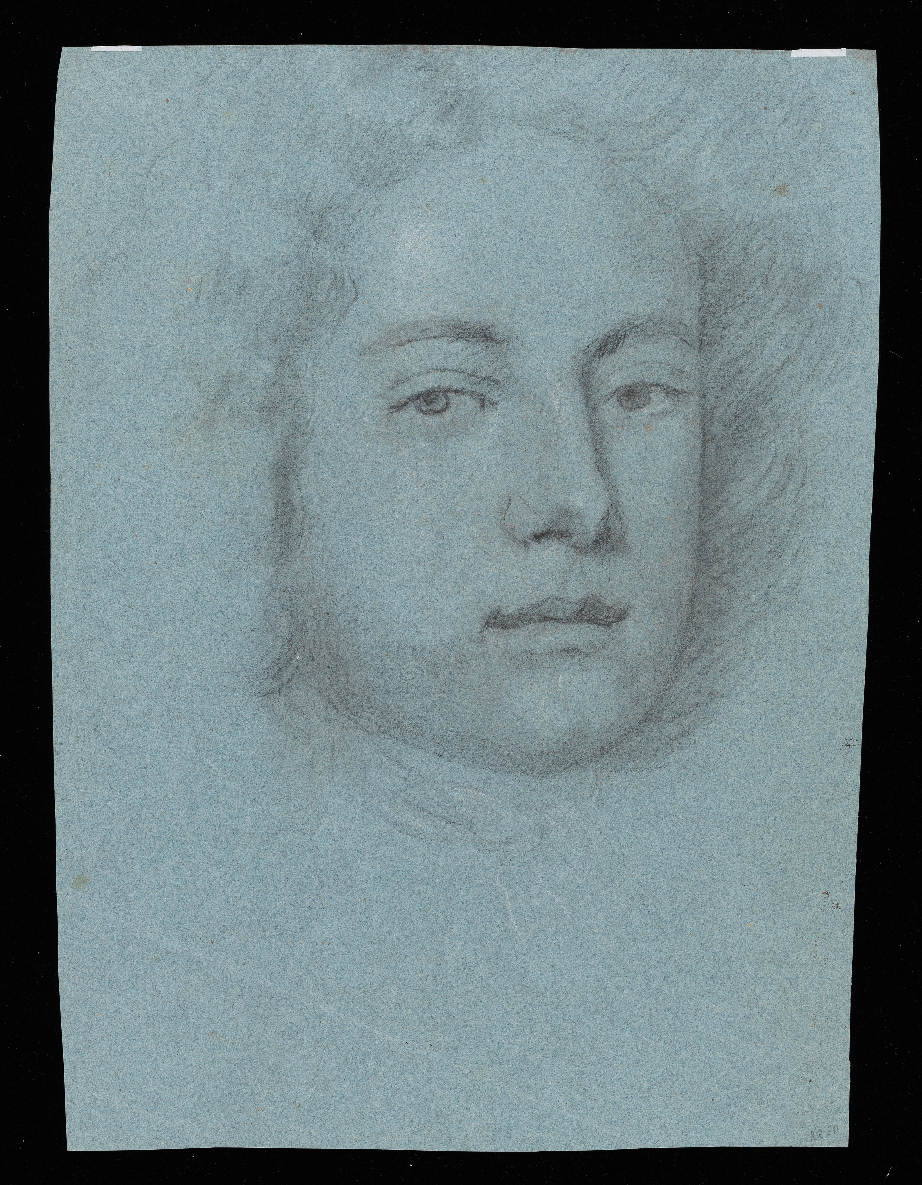Study of a young man, head only, facing slightly to the right. Made by Joseph Wright of Derby (1734 - 1797). Black and white chalk on blue paper, in cream window mount.