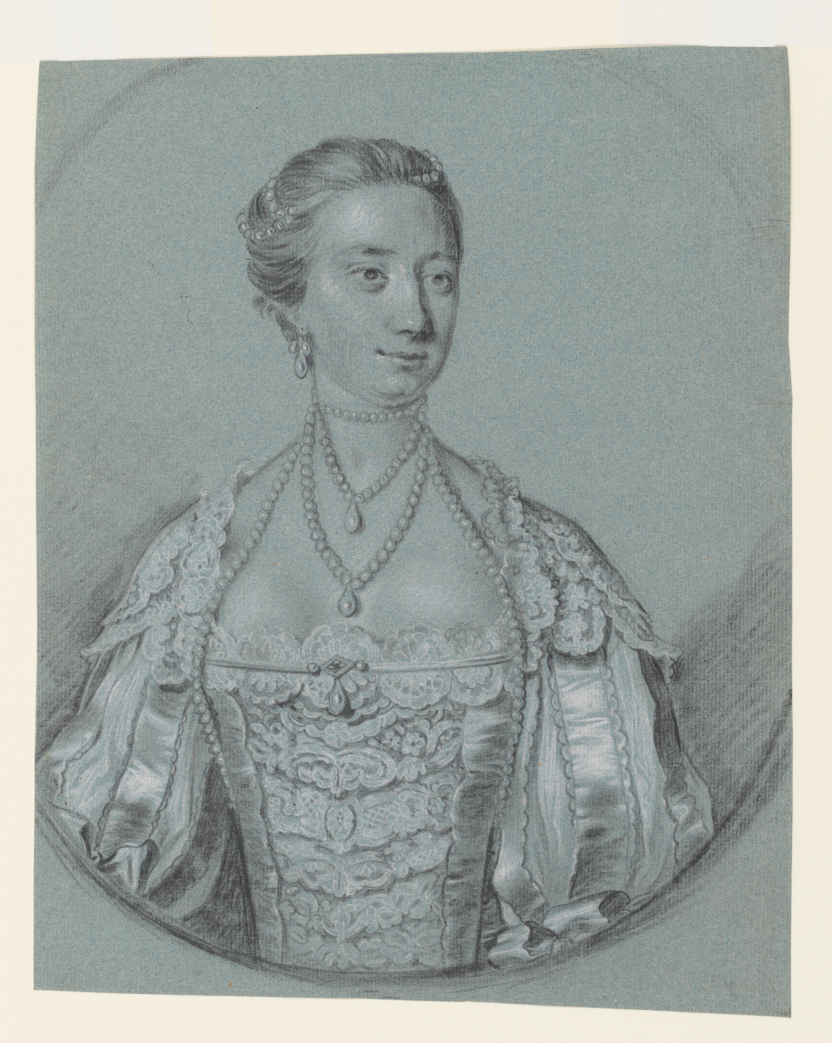 Study of a woman's arm, in Van Dyck dress, and part of her torso, with the edge of a feigned oval. She wears a slashed sleeve, decorated with a large bow and there is an outline of lace to her bodice front. Inscribed below the drawing, along the lower edge of the sheet, in ink: 'yellow Sattin Gown with purple Knots about the Sleeves. n: the front arm / is too long'. Made by Joseph Wright of Derby (1734 - 1797). Black and white chalk, with ink, on blue paper, in cream window mount.