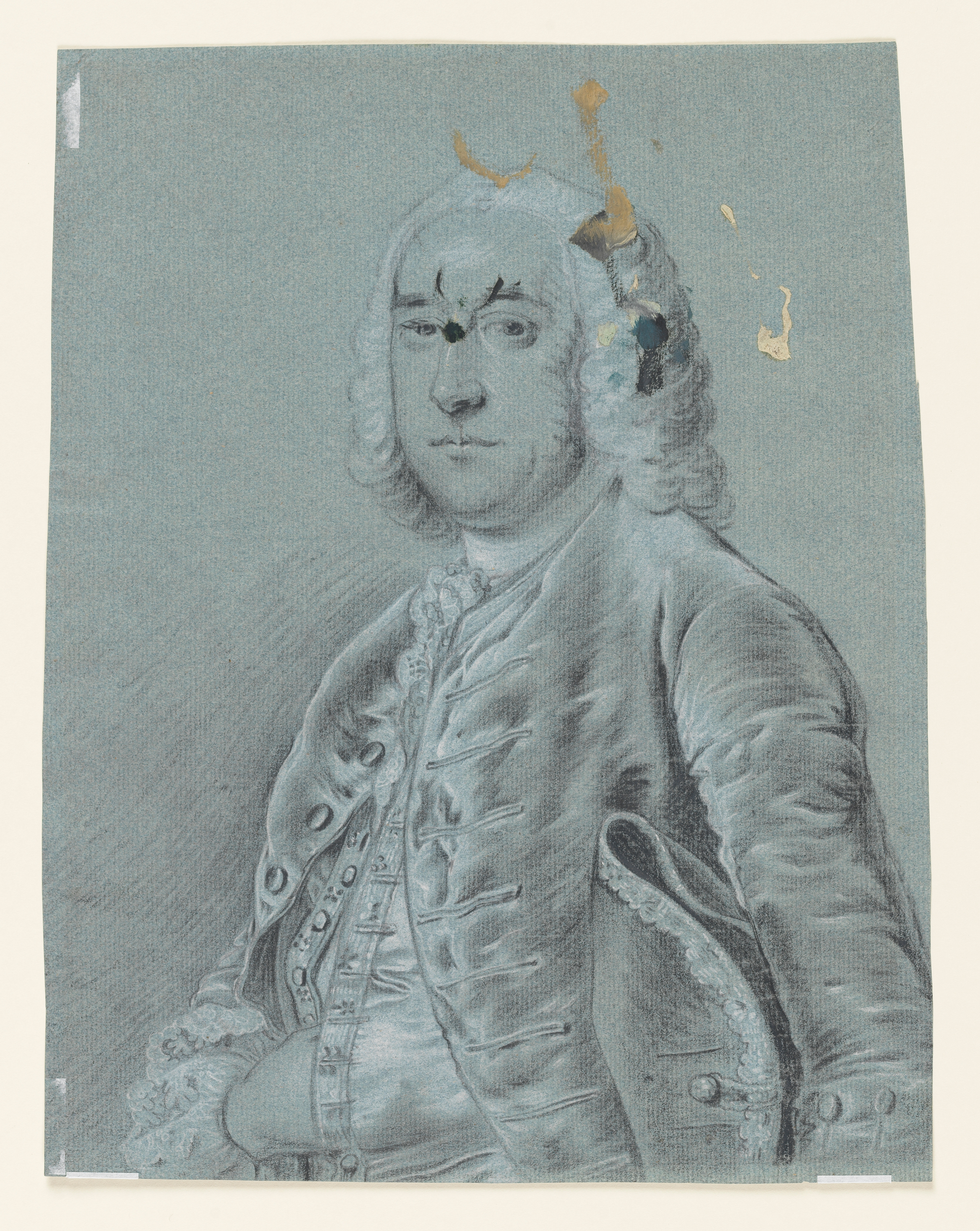 Verso: Study of a man, head and torso only, facing left, with a cocked hat under his left arm, and his right hand tucked into his waistcoat. His hat and the centre front edges of his waistcoat are decorated with elaborate lacing. Paint stains across the face and hair. Made by Joseph Wright of Derby (1734 - 1797). Black and white chalk on blue paper, in cream window mount.