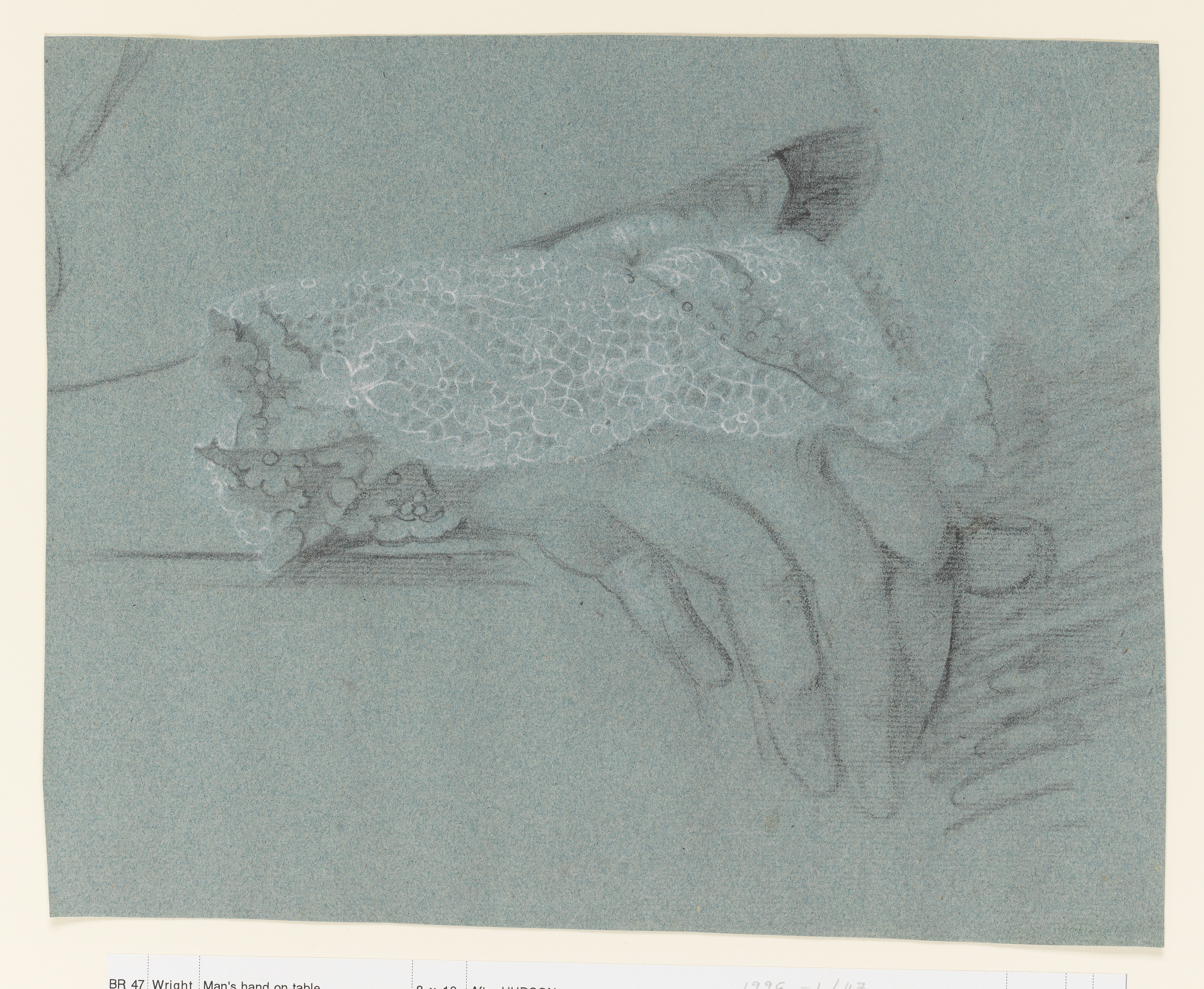 Study of a man's right hand, with a lace cuff, on a ledge, the cuff of his coat visible above. Loose shading to the right. Made by Joseph Wright of Derby (1734 - 1797). Black and white chalk on blue paper, in cream window mount.