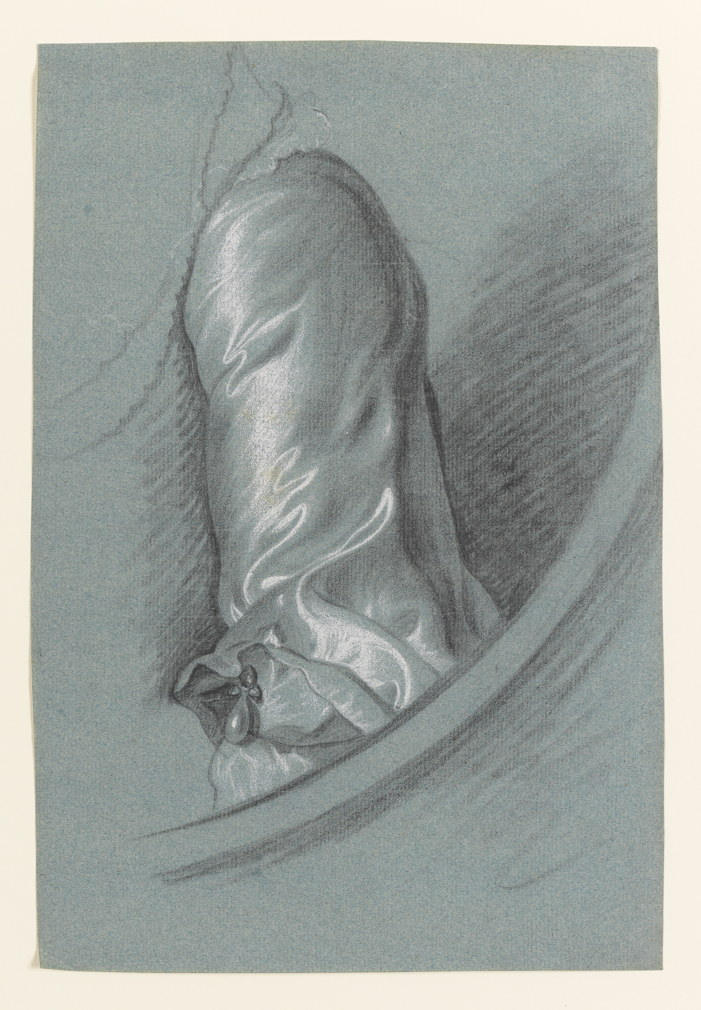 Study of a woman's left arm in a plain satin gown, a pearl-drop decorating her sleeve; the curve of a feigned oval below, to the right. Made by Joseph Wright of Derby (1734 - 1797). Black and white chalk on blue paper, in cream window mount.