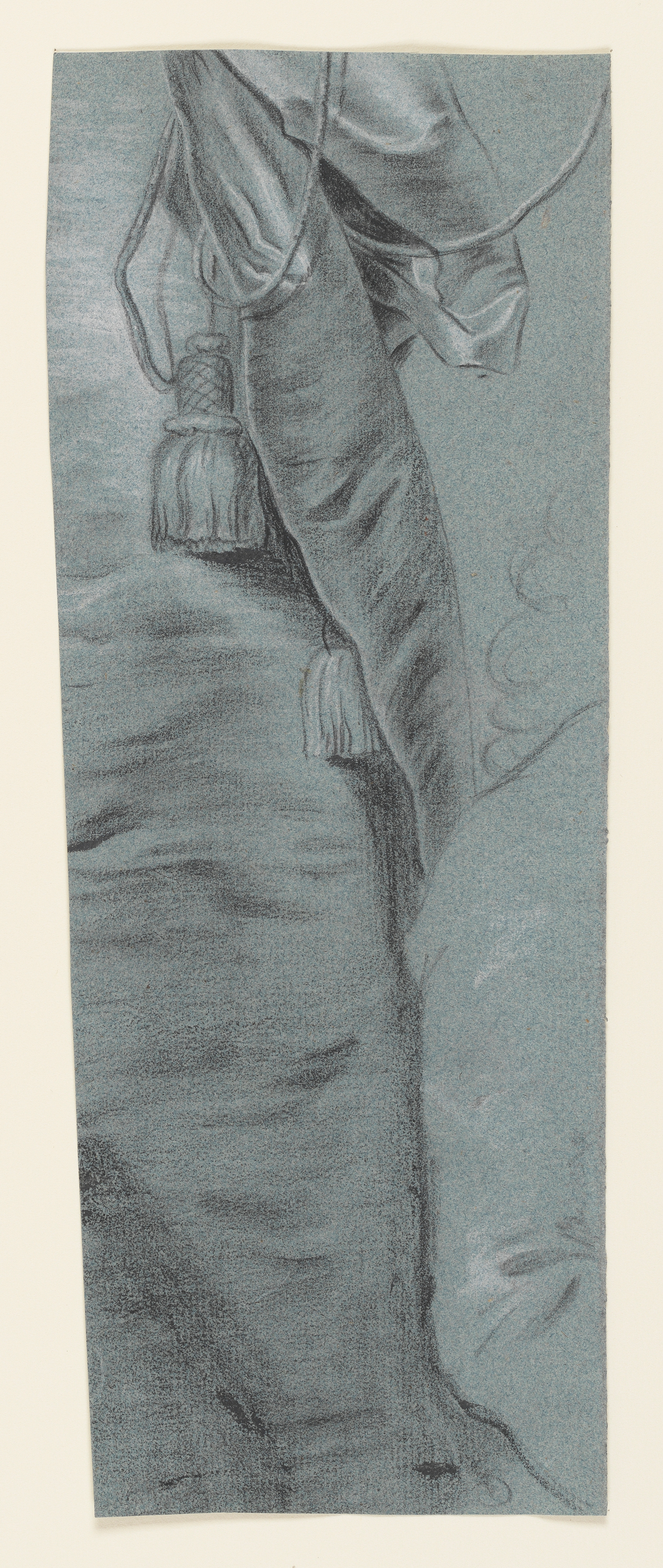 Study of a woman, her head turned slightly to the right, holding a mask in her left hand. She wears an elaborately decorated hat and an open-fronted gown. Drawn by Joseph Wright of Derby (1734 - 1797). Black and white chalk on blue laid paper displayed in a cream window mount.